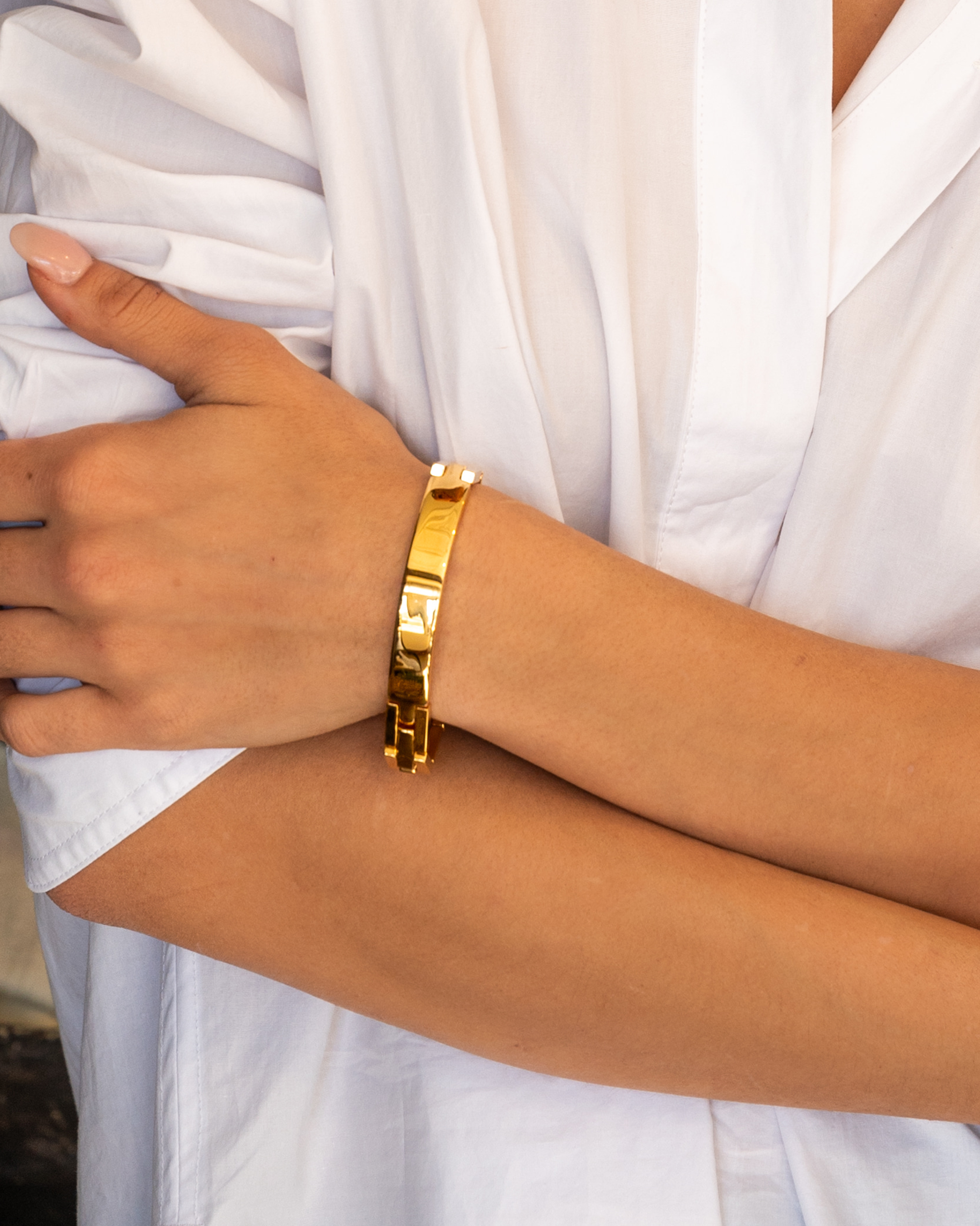 Model in white wearing ID Bracelet