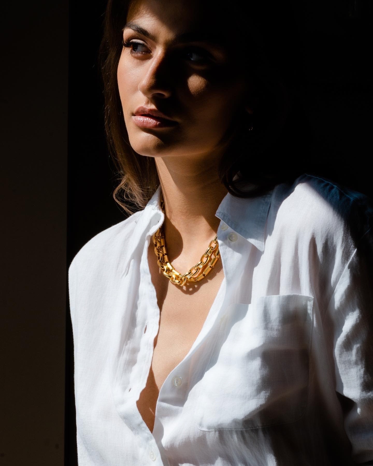 Woman in white shirt wearing Double link Necklace