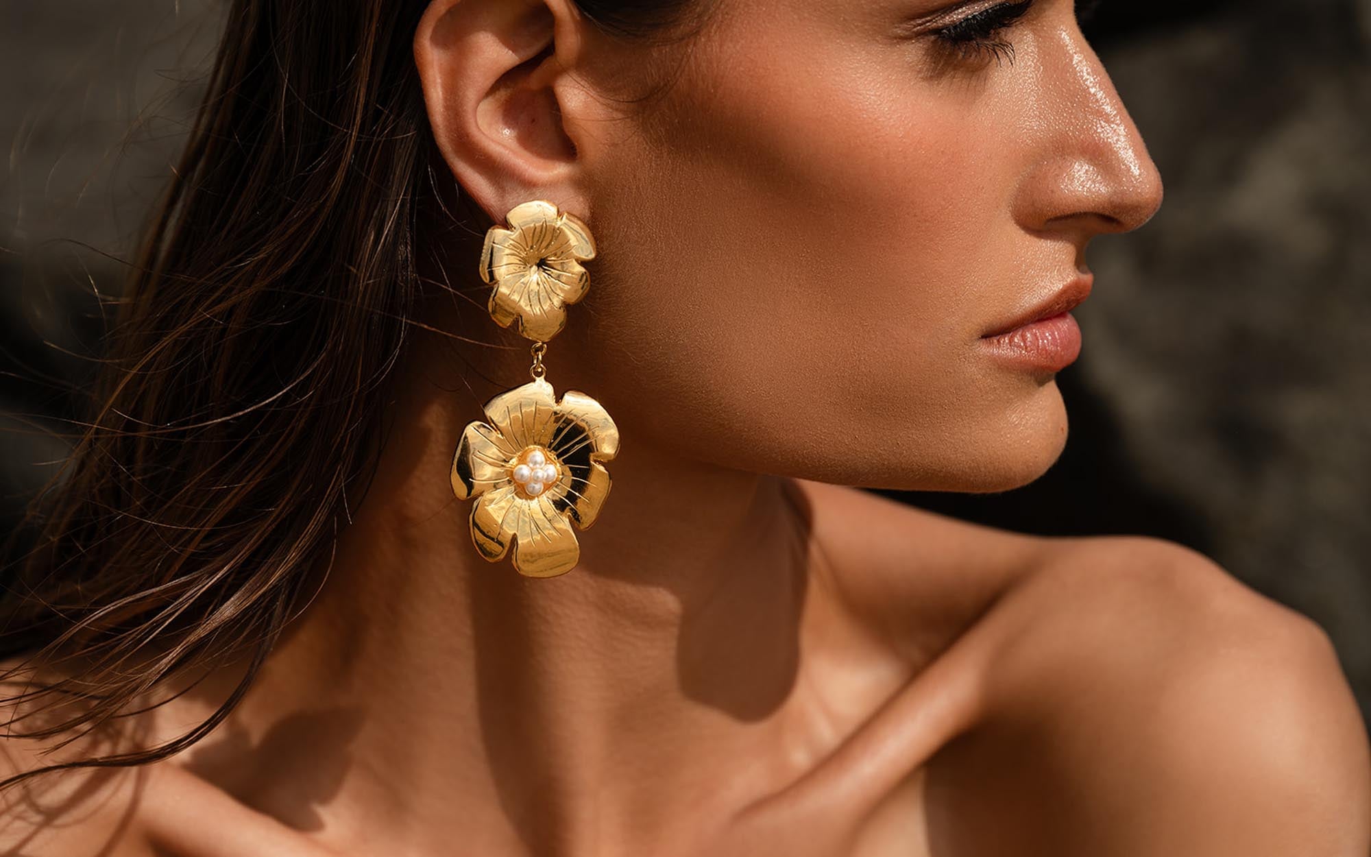 Flower earring on woman