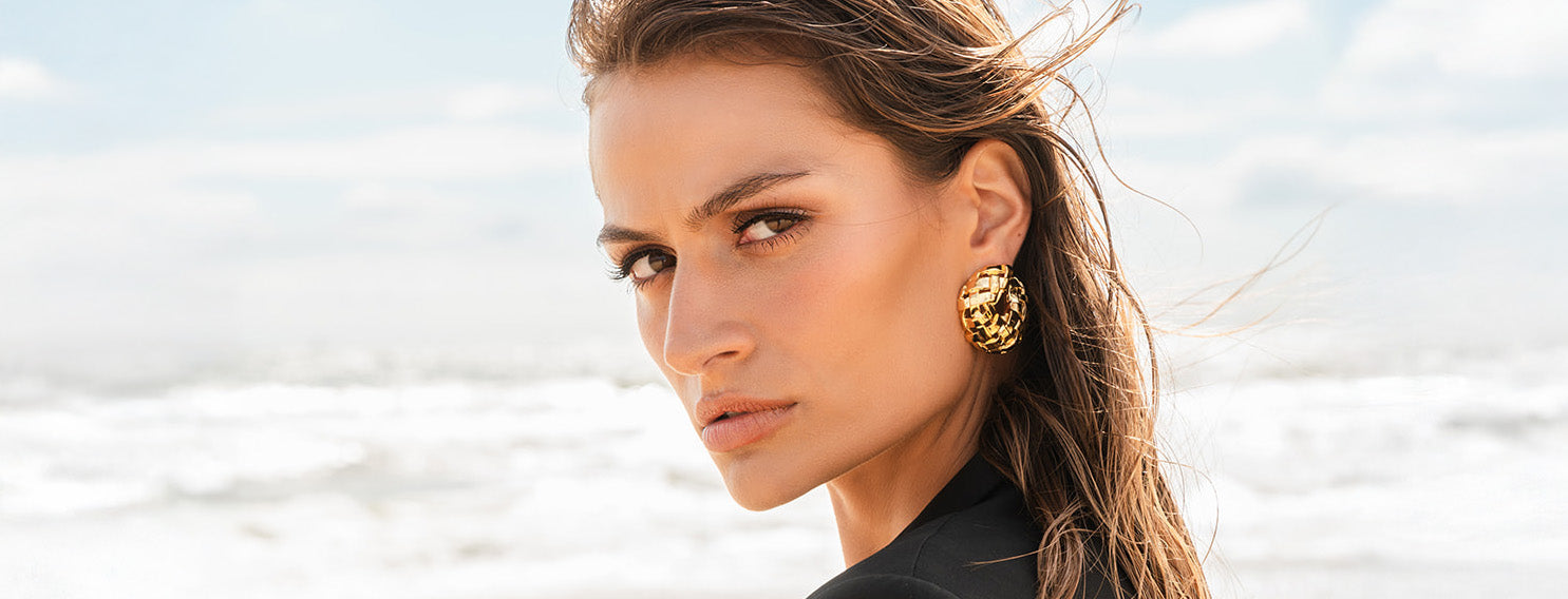 Woven C Earring on model at beach