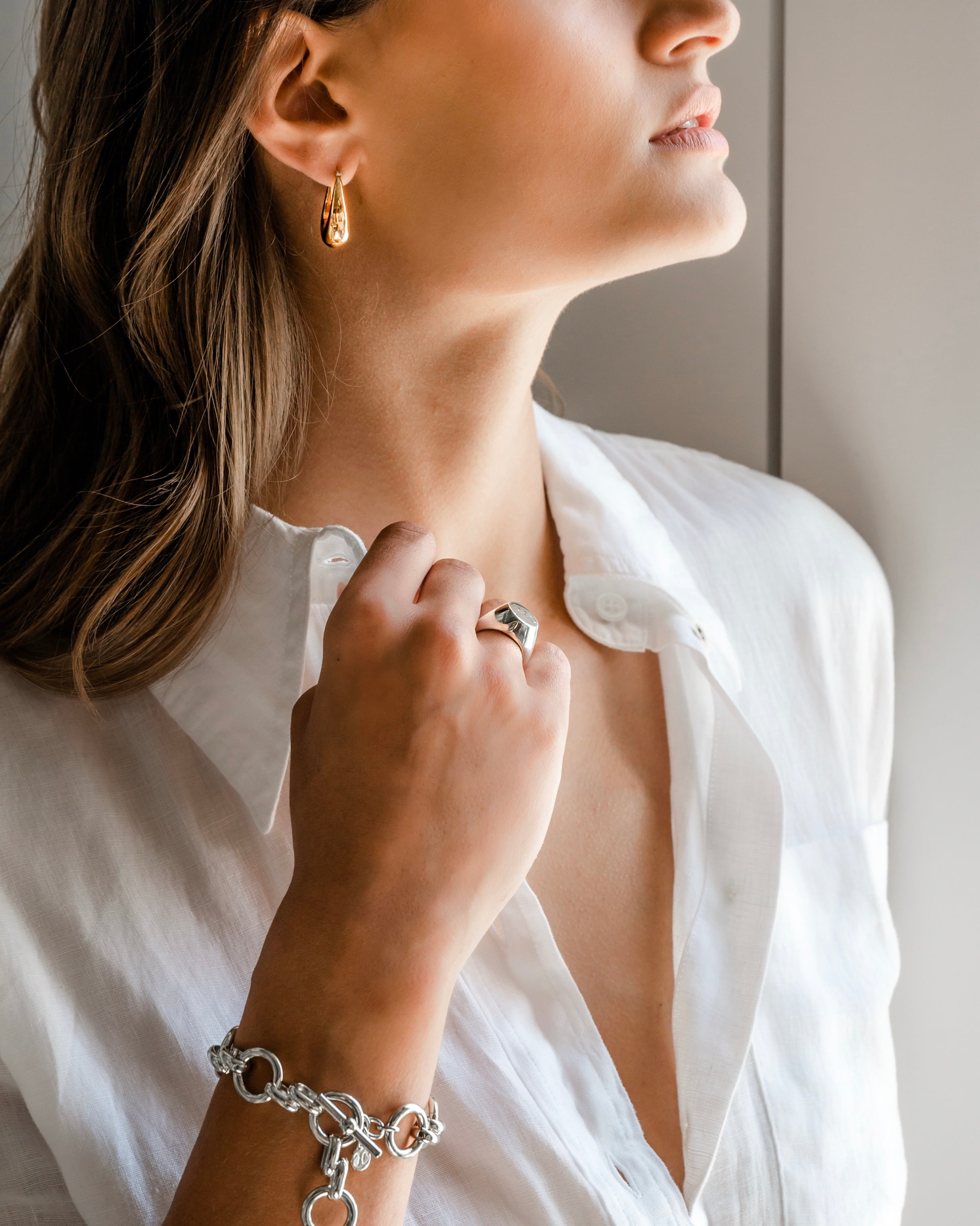 Model in white wearing Thick Hoop