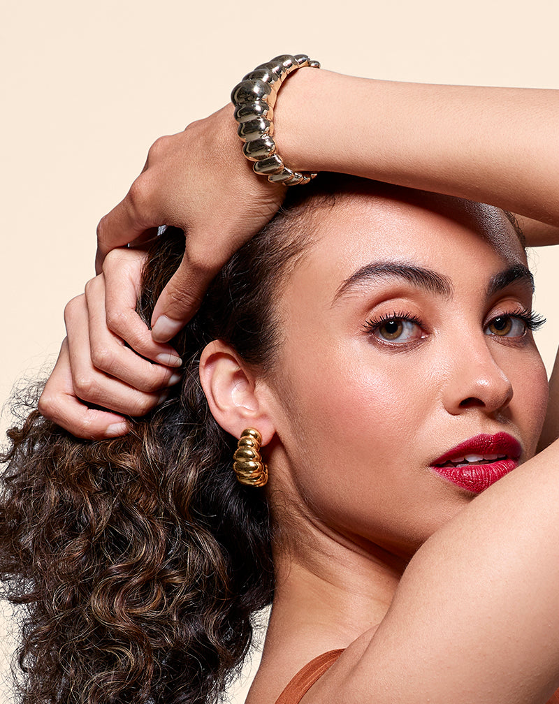 Woman wearing Tufted Earrings